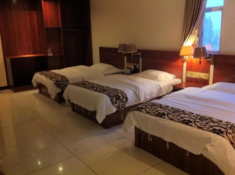 Guoxing Business Hotel Чжаоцин Экстерьер фото