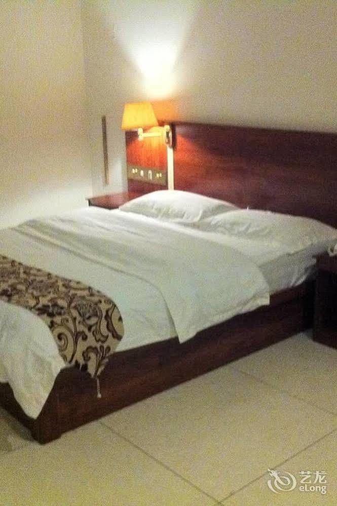 Guoxing Business Hotel Чжаоцин Экстерьер фото