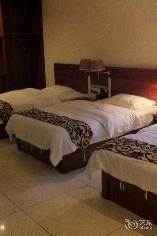 Guoxing Business Hotel Чжаоцин Экстерьер фото